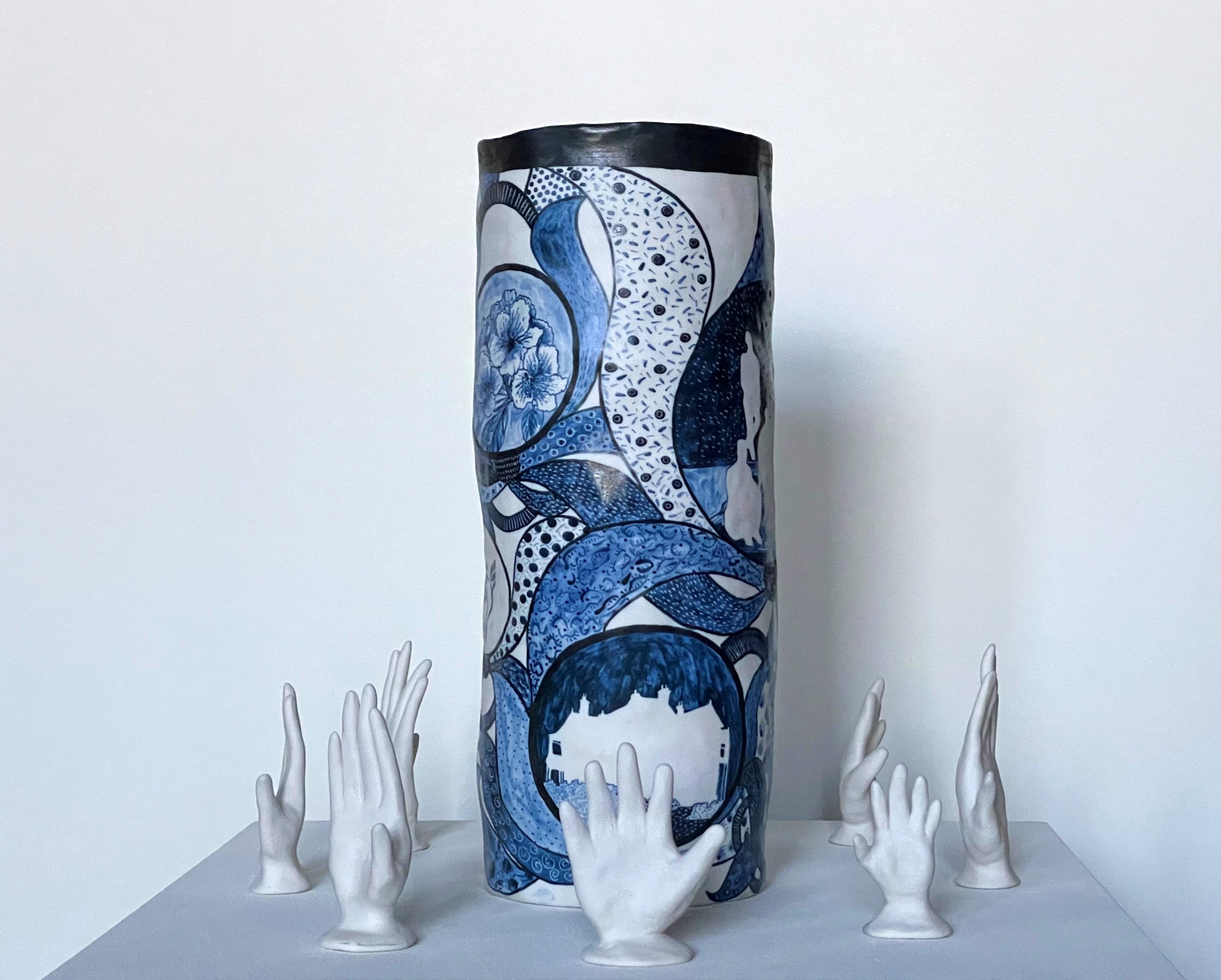A patterned blue, black and white sculptural artwork