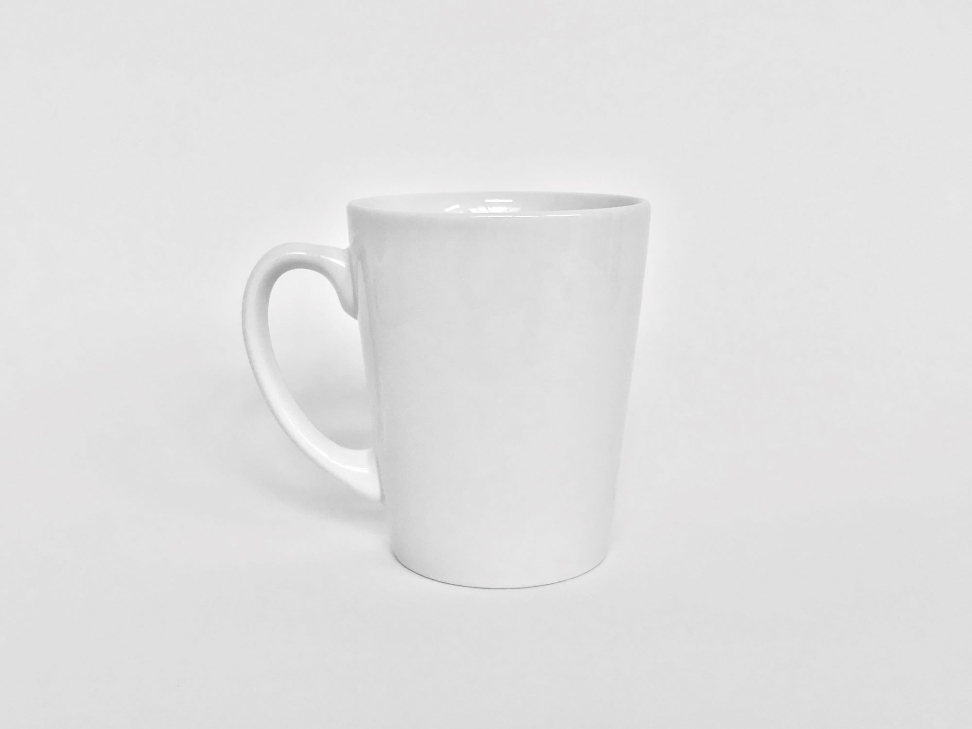 Coffee mug placed in front of a white background