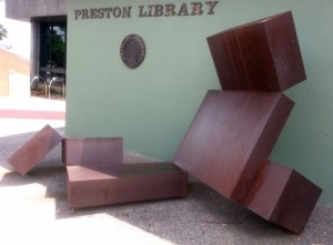 Classic formalist sculpture by Reg Parker. Visual element of the Whitlam era. Dark bronze looking abstract shapes. 