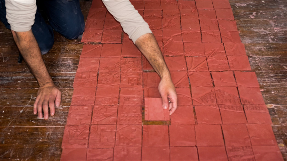 Two hands layout clay tiles 