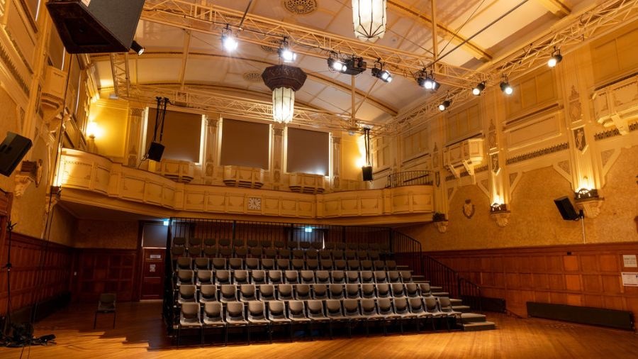 Northcote Town Hall Arts Centre's Main Hall with view of seating bank and Victorian balcony.