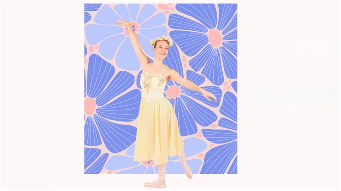 A young ballerina poses in a pink tutu.