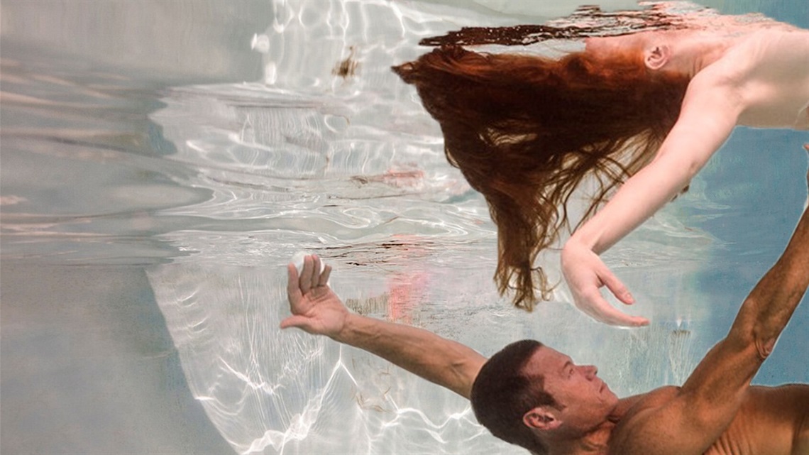 Two people float in a watery background