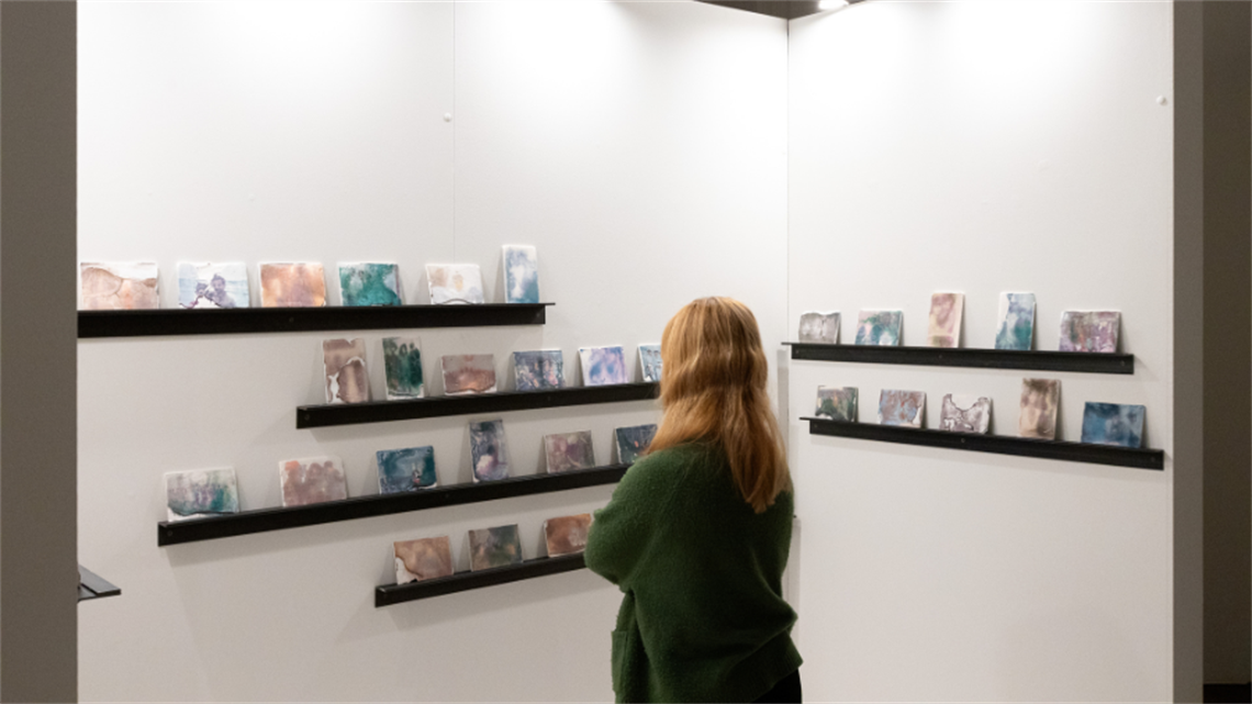 A person observes an art installation