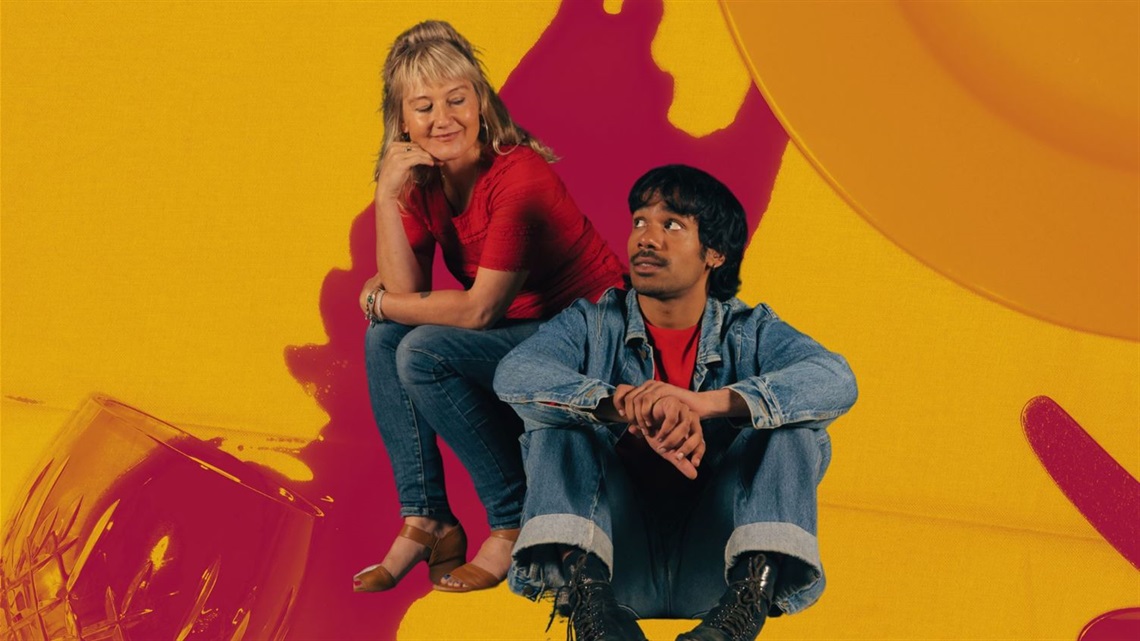 Three people sit together in a family portrait style picture.