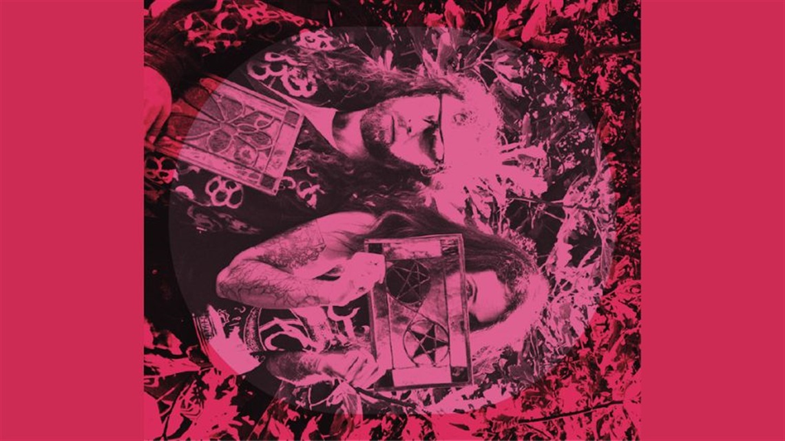 A man and a woman lean back to back on each other. They hold stain glass squares in their hands; the woman covers the bottom half of her face with the square. A dark pink hue lays across the picture. The image is purposefully lying on its side.