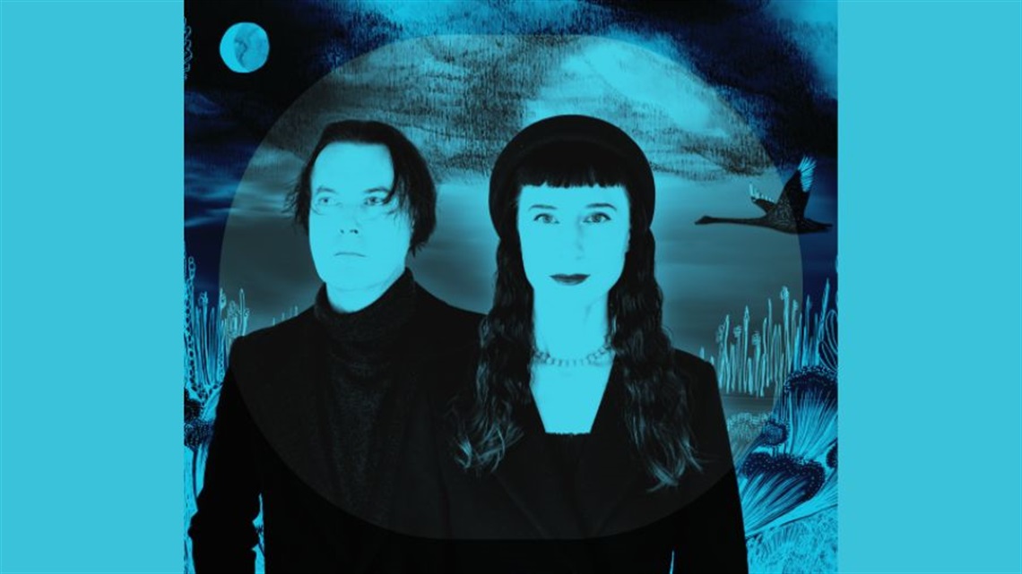 A man and a woman both with dark hair stand side by side to one another. They both wear dark clothing that covers they arms. A turquoise hue sits over the image.